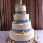4 tier blue and white wedding cake