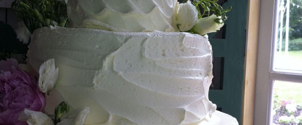 white wedding cake with flowers