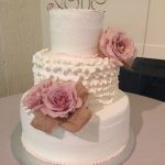 white and pink three tier wedding cake