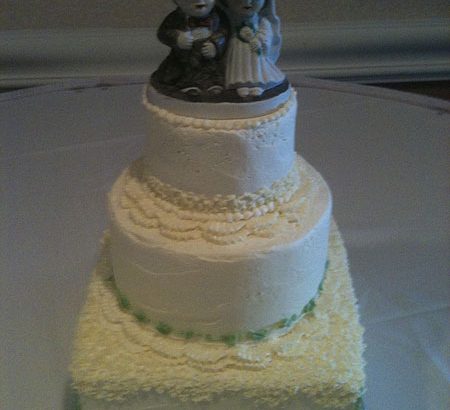 man and wife on cake top