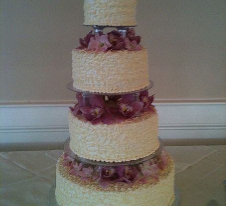 purple flowers on white cake