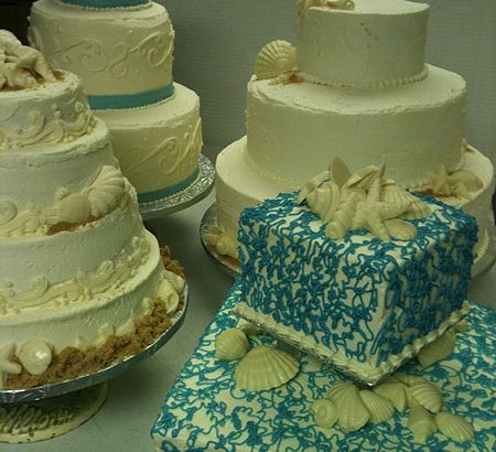 multiple beach themed wedding cakes