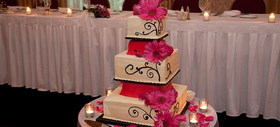 pink flowers on a wedding cake at wedding