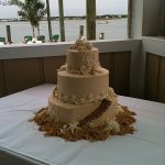 wedding cake with sand and shells