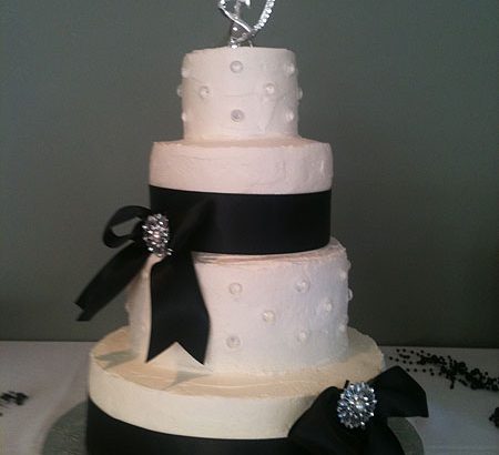 black ribbon on white wedding cake